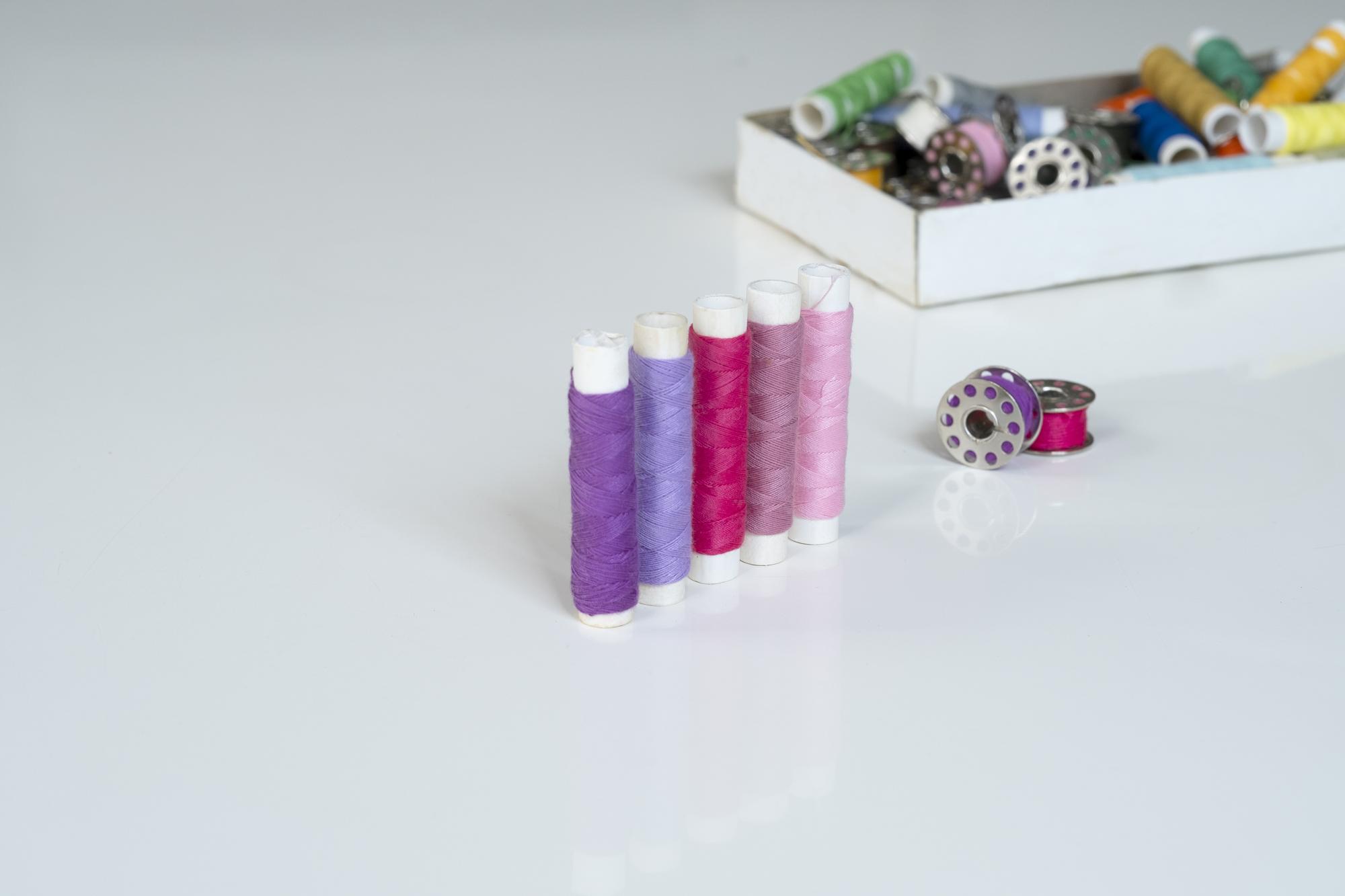three embroidery kits displayed on table